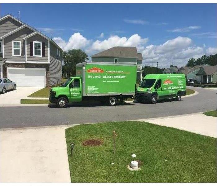 SERVPRO of Downtown Charleston Box truck and Van parked in front of a clients house